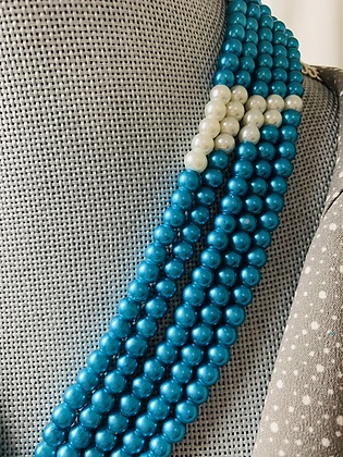 Blue and white handmade beaded necklace closeup