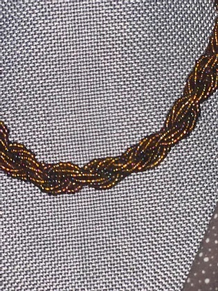 braided brown beaded necklace closeup