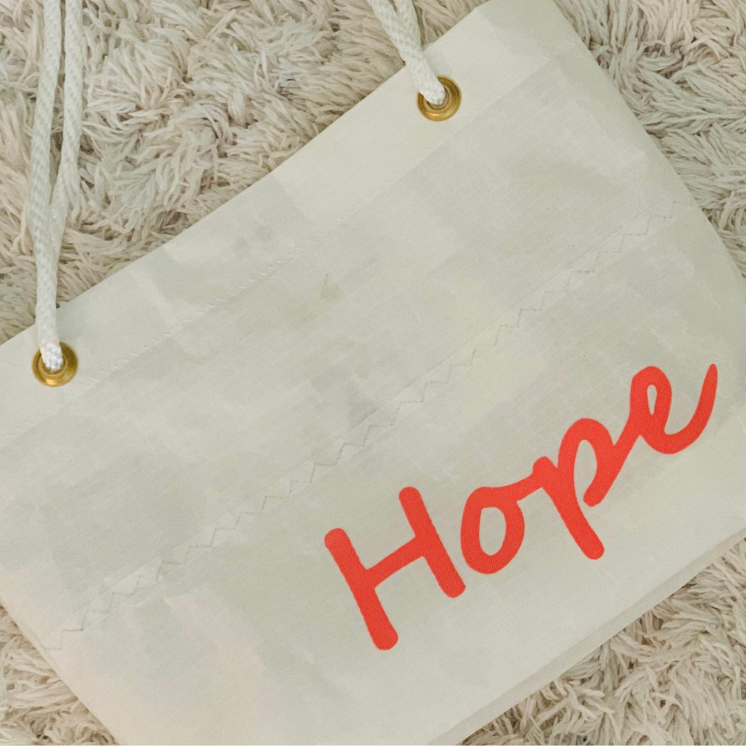 White bag with Hope written in pink